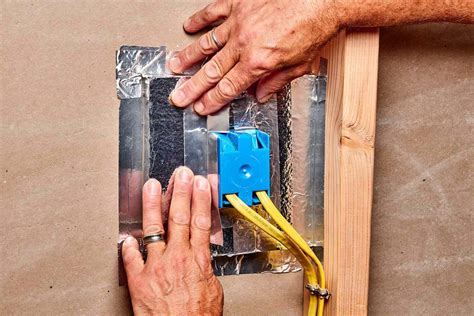 can you put insulation around electrical box|how to insulate around outlets.